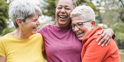 Three friends laughing together